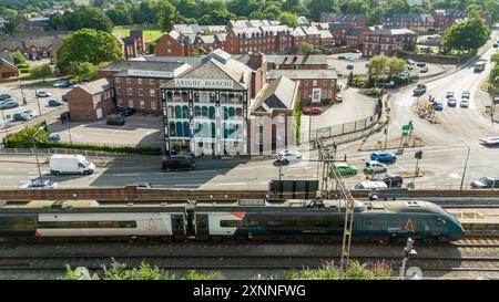 Aerial view Macclesfield Arighi Bianchi landmark store as a train works int the station Stock Photo