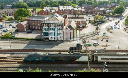 Aerial view Macclesfield Arighi Bianchi landmark store as a train works int the station Stock Photo