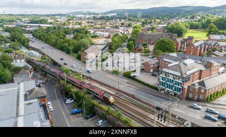 Aerial view Macclesfield Arighi Bianchi landmark store as a train works out of the station Stock Photo