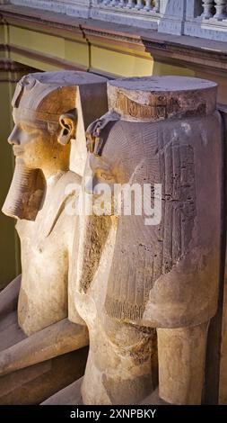 Cairo,Egypt,December 31,2019-Side view of the Colossi of Amenhotep III and his Royal Wife Tiye,the largest known dyad ever carved found in Luxor at the Museum of Egyptian antiquities in Cairo,Egypt Stock Photo