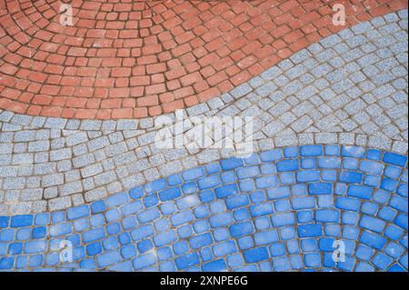 texture of a sidewalk paved with multicolored paving slabs Stock Photo