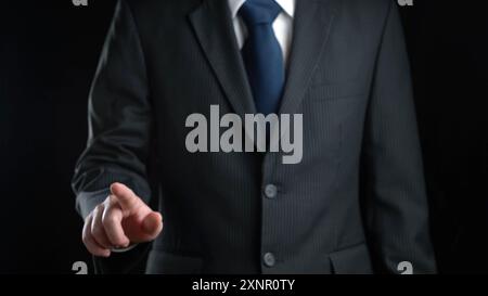 Business Man pushing on a touch screen interface Business man touching an imaginary screen Stock Photo