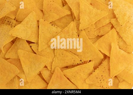 background of corn tortilla chips or nachos, mexican fast food, salty snack Stock Photo