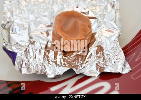 Single Toffee on Silver Wrapper Stock Photo