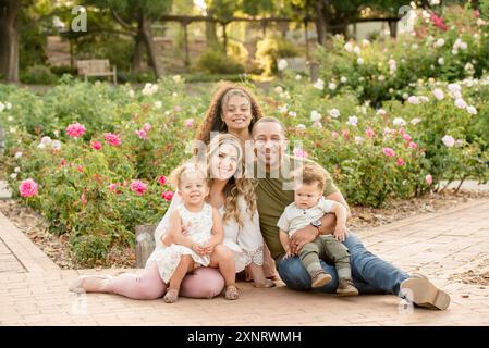 Biracial family of five smiling Stock Photo