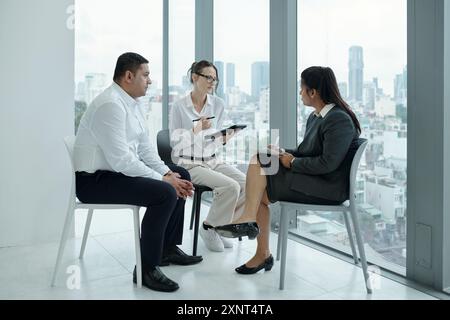 Business People Having Meeting In Office Stock Photo