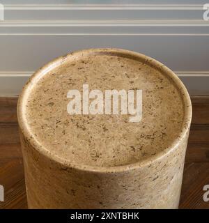 High angle close-up of a round marble side table. The table has a sleek marble surface and a minimalist frame Stock Photo