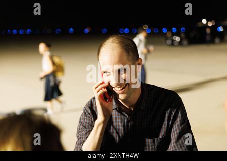 Evan Gershkovich greets colleagues from the Wall Street Journal at Andrews Air Force Base, after he was released from Russian prison as part of a prisoner swap, on Thursday, August 02, 2024. Credit: Aaron Schwartz/CNP /MediaPunch Stock Photo