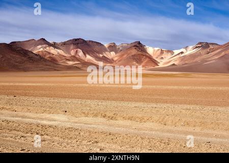 Panoramic view of the arid Atacama Desert with colorful mountains under a blue sky. Vast landscapes and natural beauty of this remote location. Stock Photo