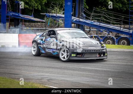 Powerful drift car burning rubber tyres on race track Stock Photo