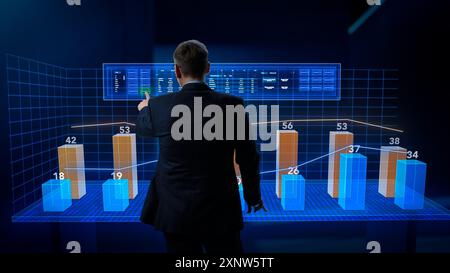 Businessman Working in Minimalistic Digital Space. Manager Using a Virtual Touch Screen Hologram with Multiple Options, Generating Percentage Charts and Infographics Based on Financial Big Data Stock Photo