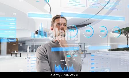 Handsome Man Standing in Futuristic Virtual Space, Interacting with an Augmented Reality Hologram with Business Data, Financial Reports, Stock Market Statistics, Infographics, Charts Stock Photo