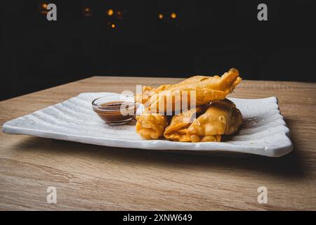 Gourmet fried spring rolls on a restaurant table. Stock Photo