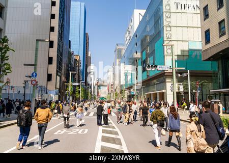 People walking and shopping along Chuo Dori street on Sunday in upscale ...