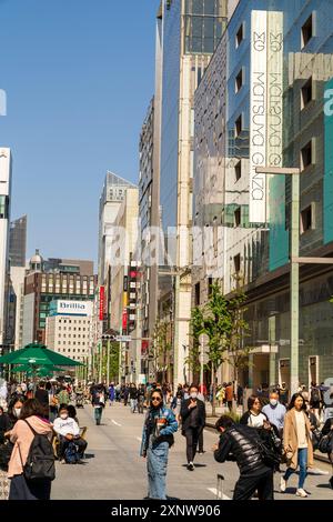 People walking and shopping along Chuo Dori street on Sunday in upscale ...
