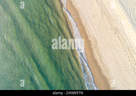 empty beach and sea waves seen from above, top aerial view from drone. Summer concept Stock Photo