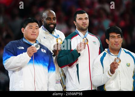 Gold medalist Teddy Riner of France (second left), silver medalist Minjong Kim (left) of South Korea, bronze medalists Temur Rakhimov of Tajikistan and Yusupov Alisher (right) of Uzbekistan at the Champ-de-Mars Arena on the seventh day of the 2024 Paris Olympic Games in France. Picture date: Friday August 2, 2024. Stock Photo