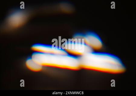 Colorful refracted sunlight through stained glass window Stock Photo