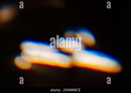 Colorful refracted sunlight through stained glass window Stock Photo