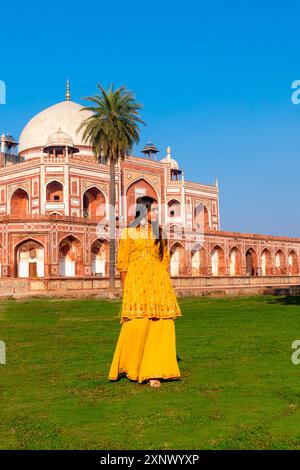 Young Indian Girl in front of Humayun's Tomb, UNESCO World Heritage Site, Delhi, India, South Asia, Asia Stock Photo