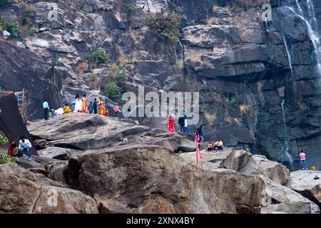 Local tribal women gather near Hundru waterfall to feast Shiva, the Supreme being in Hindu Shaivism, Ranchi, Jharkhand, India Stock Photo