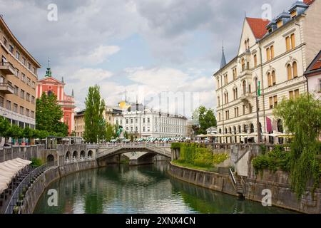 A stretch of the River Ljubljanica leading towards the Triple Bridge, designed in 1932 by Joze Plecnik, and city centre, Ljubljana, Slovenia, Europe Stock Photo