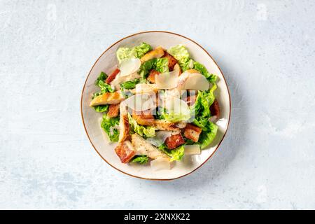 Caesar salad with chicken, romaine and Parmesan, shot from the top Stock Photo