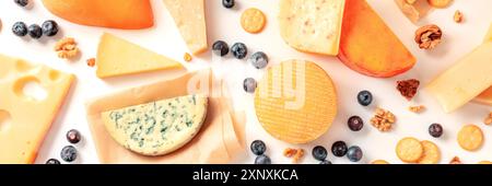 Cheese variety panorama. Various cheeses, shot from above on a white background, a flat lay Stock Photo