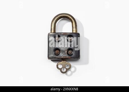 Antique padlock isolated on white background. Closed concept Stock Photo
