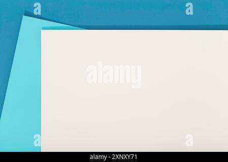 Abstract blue and beige color paper geometry composition background. Group of three color cardboard. Copy space Stock Photo