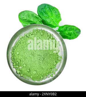 Spinach powder isolated on white background (close up, selective focus) Stock Photo