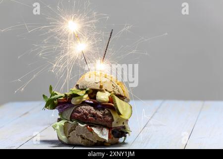 Cheeseburger with candle Stock Photo