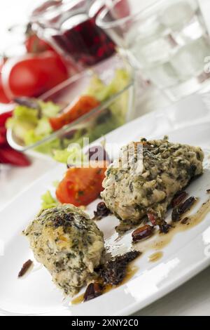Italian strangolapreti dumplings on a plate Stock Photo