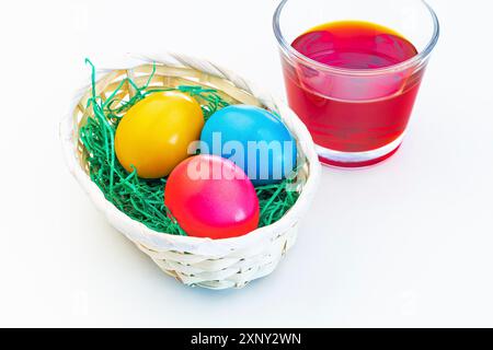 Colouring and decorating Easter eggs Stock Photo