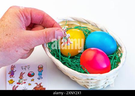 Colouring and decorating Easter eggs Stock Photo