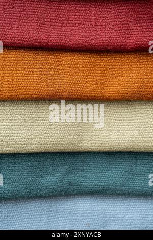 Different colored fabric samples for curtains or furniture made of natural material to choose the best for the interior design at home, full frame Stock Photo