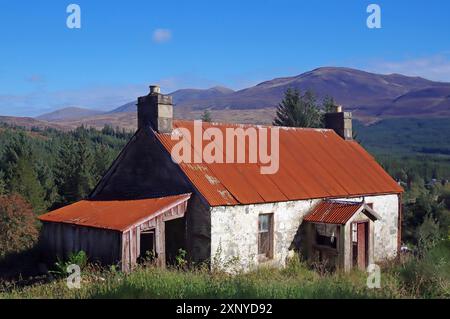 An old farmhouse with a rusty roof in a remote mountain landscape, autumn, October, Highlands, Scotland, Great Britain Stock Photo