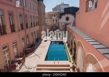 Luxurious Hotel Courtyard with Rectangular Pool and Elegant ...