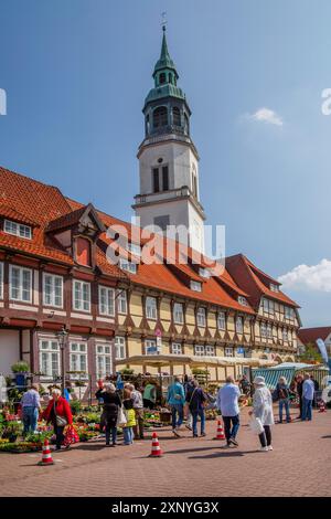 Weekly market with typical half-timbered houses in the old town centre and the tower of the town church, Celle, Lueneburg Heath, Lower Saxony, Germany Stock Photo