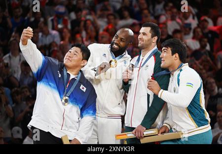 Paris, France. 2nd Aug, 2024. Gold medalist Teddy Riner (2nd L) of France, silver medalist Kim Min-jong (1st L) of South Korea, and bronze medalists Temur Rakhimov (2nd R) of Tajikistan and Alisher Yusupov of Uzbekistan take selfies during the victory ceremony of men's  100kg judo at the Paris 2024 Olympic Games in Paris, France, on Aug. 2, 2024. Credit: Wu Wei/Xinhua/Alamy Live News Stock Photo