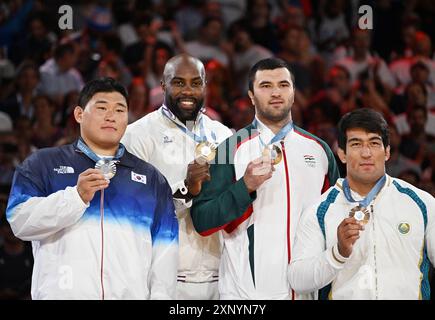 Paris, France. 2nd Aug, 2024. Gold medalist Teddy Riner (2nd L) of France, silver medalist Kim Min-jong (1st L) of South Korea, and bronze medalists Temur Rakhimov (2nd R) of Tajikistan and Alisher Yusupov of Uzbekistan pose for photos during the victory ceremony of men's  100kg judo at the Paris 2024 Olympic Games in Paris, France, on Aug. 2, 2024. Credit: Wu Wei/Xinhua/Alamy Live News Stock Photo