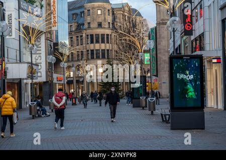 First day of the Christmas lockdown in the Corona crisis, empty shopping alleyway Schildergasse, closed shops, hardly any passers-by, lightboard Stock Photo