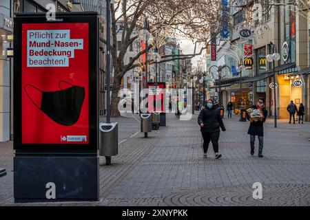 First day of the Christmas lockdown in the Corona crisis, empty shopping alleyway Schildergasse, closed shops, hardly any passers-by, lightboard Stock Photo