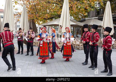 Plovdiv, Bulgaria, November 26, 2021: Young wine parade in the Old Town, traditional folklore dances Stock Photo