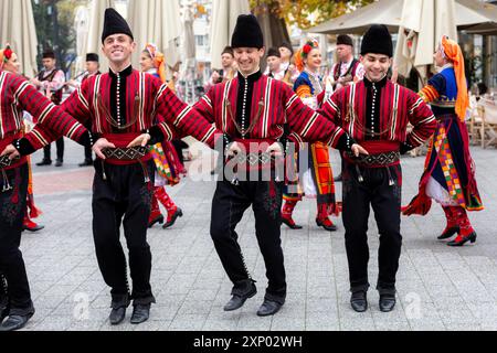 Plovdiv, Bulgaria, November 26, 2021: Young wine parade in the Old Town, traditional folklore dances Stock Photo