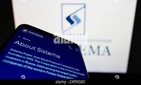 Stuttgart, Germany, 03-05-2022: Smartphone with webpage of Russian conglomerate AFK Sistema PAO on screen in front of business logo. Focus on Stock Photo