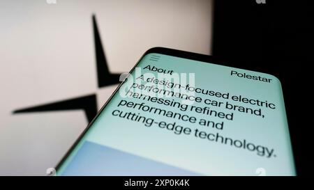 Stuttgart, Germany, 01-23-2022: Mobile phone with webpage of Swedish electric vehicle company Polestar AB on screen in front of business logo. Focus Stock Photo