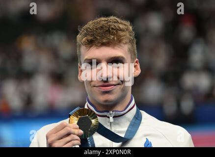 2nd August 2024; Paris Olympic Games, Paris, France, Day 7; Swimming finals at Arena La Defence, Mens 200m individual medley final, Leon Marchand of France with his Gold medal Stock Photo