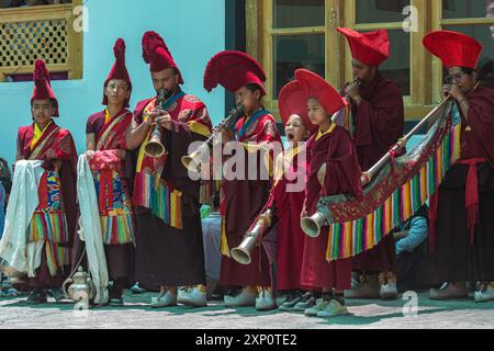 Ladakhi monks in a cultural festival playing musical instrument wearing traditional at Leh, India on 5 July 2024 Stock Photo