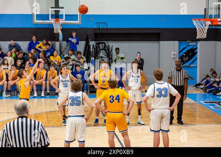 A Blackhawk Christian player shoots a free throw during an IHSAA boys basketball game at Lakewood Park High School near Auburn, Indiana, USA. Stock Photo